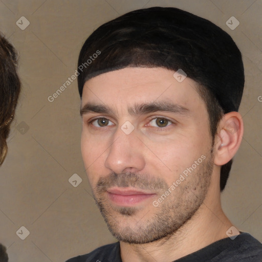 Joyful white young-adult male with short  black hair and brown eyes