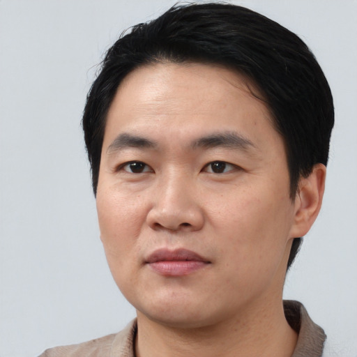 Neutral asian young-adult male with short  black hair and brown eyes