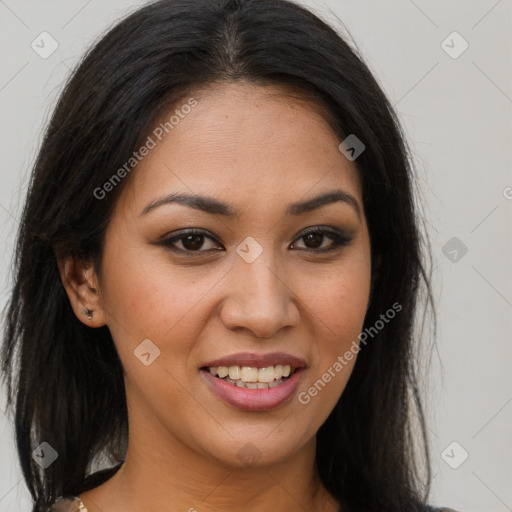 Joyful latino young-adult female with long  brown hair and brown eyes