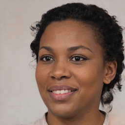 Joyful black young-adult female with medium  brown hair and brown eyes