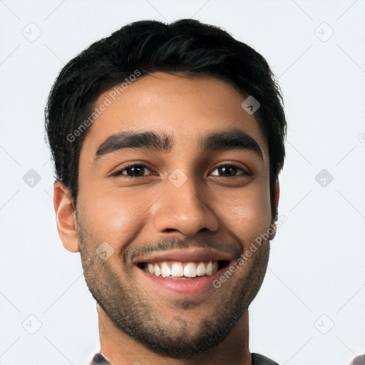 Joyful latino young-adult male with short  black hair and brown eyes