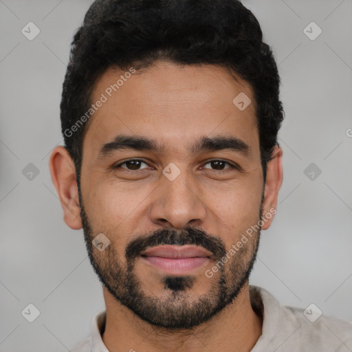 Joyful latino young-adult male with short  black hair and brown eyes