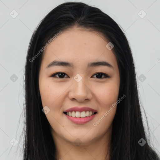 Joyful asian young-adult female with long  brown hair and brown eyes