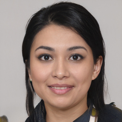 Joyful asian young-adult female with medium  black hair and brown eyes