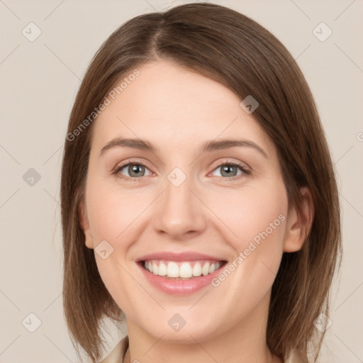 Joyful white young-adult female with medium  brown hair and green eyes