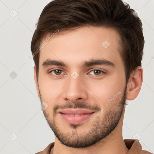 Joyful white young-adult male with short  brown hair and brown eyes