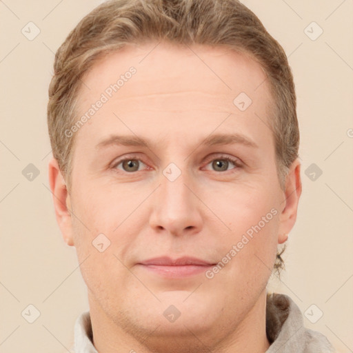 Joyful white adult male with short  brown hair and grey eyes