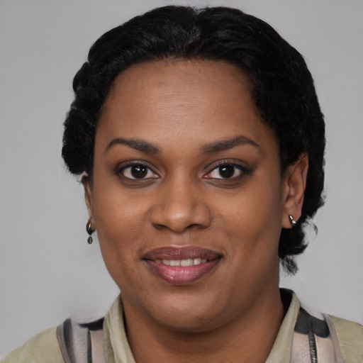 Joyful latino young-adult female with short  black hair and brown eyes