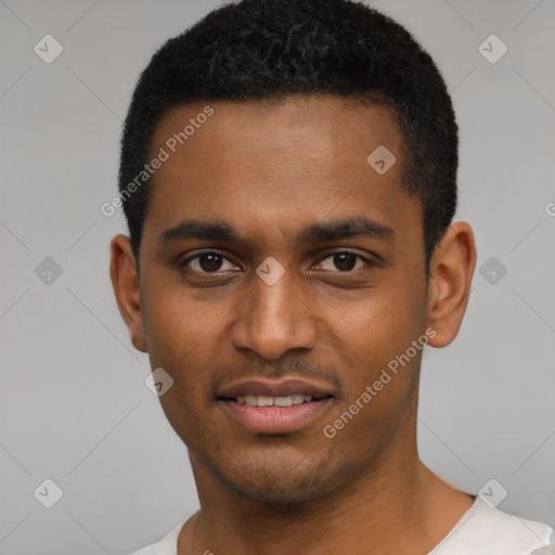 Joyful black young-adult male with short  black hair and brown eyes