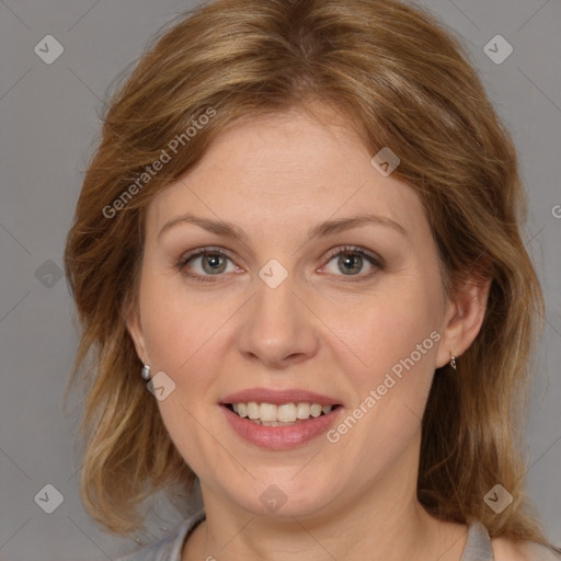 Joyful white adult female with medium  brown hair and grey eyes