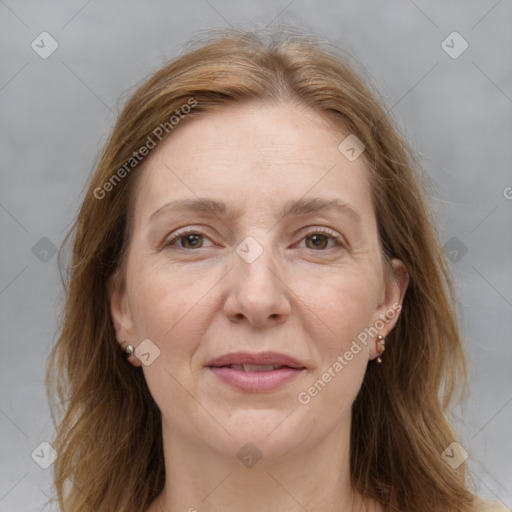 Joyful white adult female with medium  brown hair and grey eyes