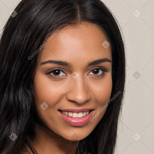 Joyful latino young-adult female with long  brown hair and brown eyes