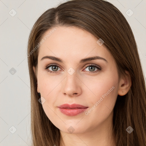 Joyful white young-adult female with long  brown hair and green eyes