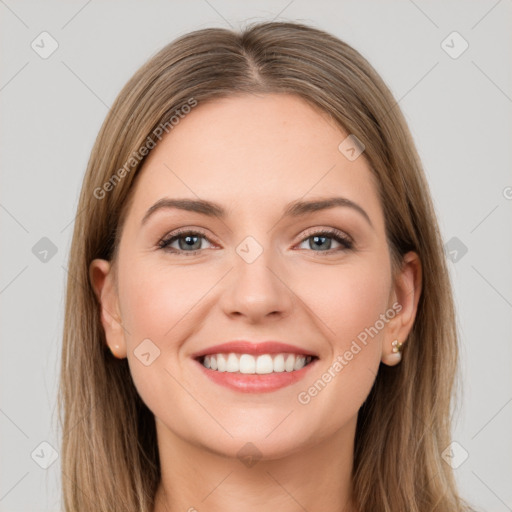 Joyful white young-adult female with long  brown hair and grey eyes