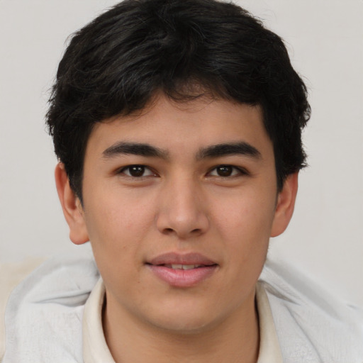 Joyful asian young-adult male with short  brown hair and brown eyes