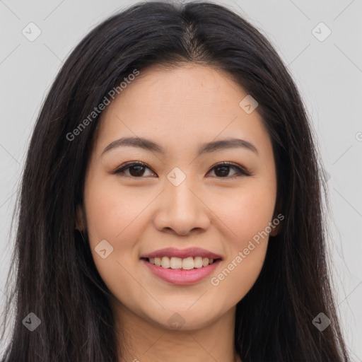 Joyful asian young-adult female with long  brown hair and brown eyes