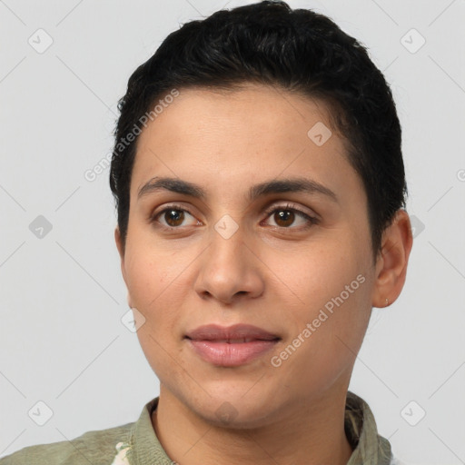 Joyful latino young-adult female with short  black hair and brown eyes