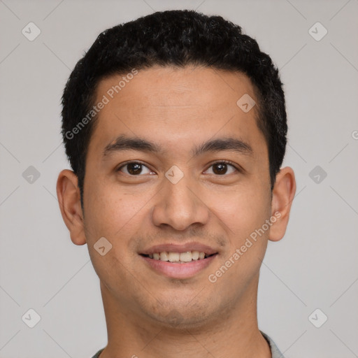 Joyful latino young-adult male with short  black hair and brown eyes