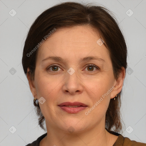 Joyful white adult female with medium  brown hair and brown eyes