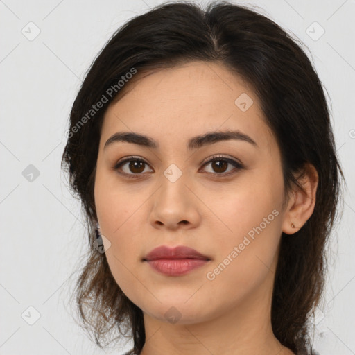 Joyful latino young-adult female with medium  brown hair and brown eyes