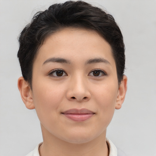 Joyful asian young-adult female with short  brown hair and brown eyes