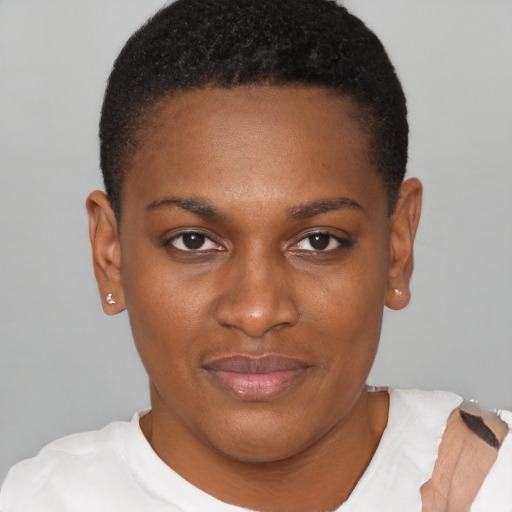 Joyful black young-adult female with short  brown hair and brown eyes