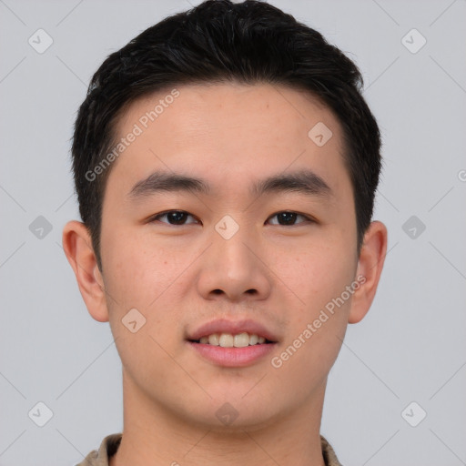 Joyful asian young-adult male with short  brown hair and brown eyes