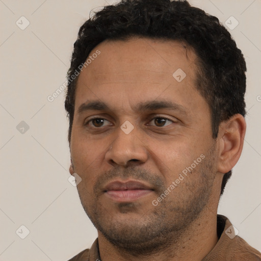 Neutral white adult male with short  black hair and brown eyes