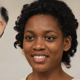 Joyful black young-adult female with medium  black hair and brown eyes