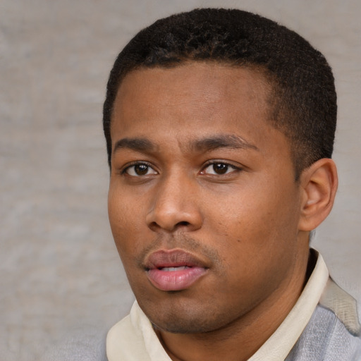 Neutral latino young-adult male with short  black hair and brown eyes