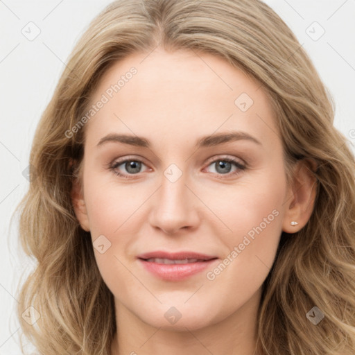 Joyful white young-adult female with long  brown hair and blue eyes