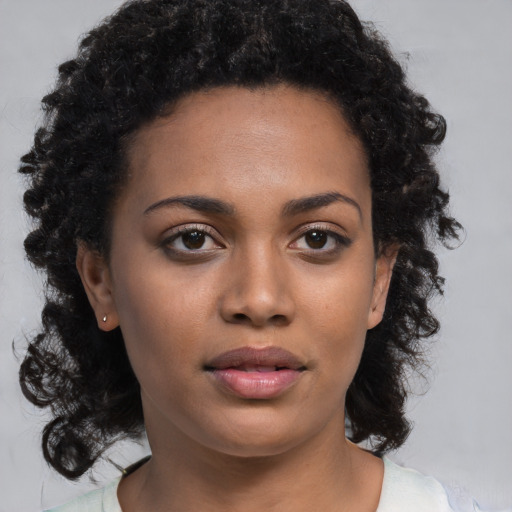 Neutral black young-adult female with medium  black hair and brown eyes