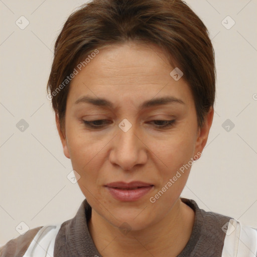 Joyful white adult female with short  brown hair and brown eyes