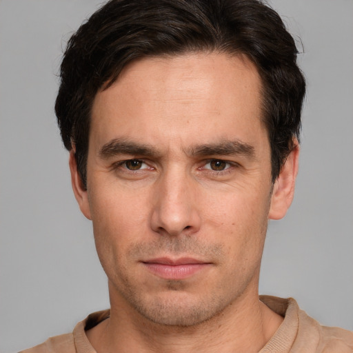 Neutral white young-adult male with short  brown hair and brown eyes