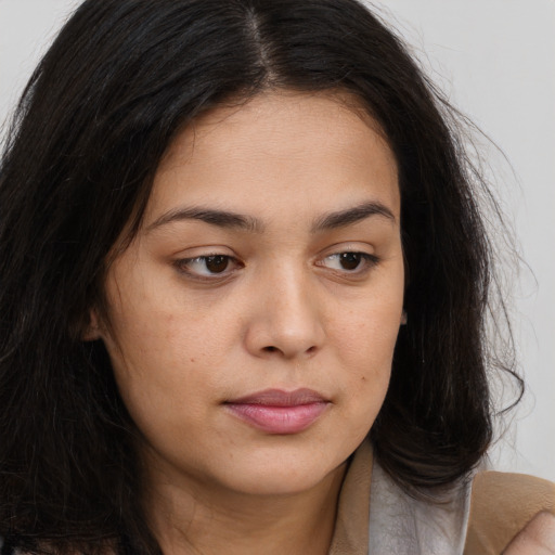 Joyful asian young-adult female with long  brown hair and brown eyes