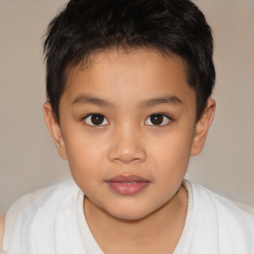 Joyful white child male with short  brown hair and brown eyes