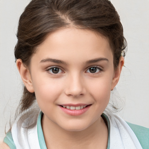 Joyful white child female with medium  brown hair and brown eyes