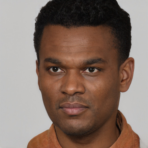 Neutral black young-adult male with short  black hair and brown eyes