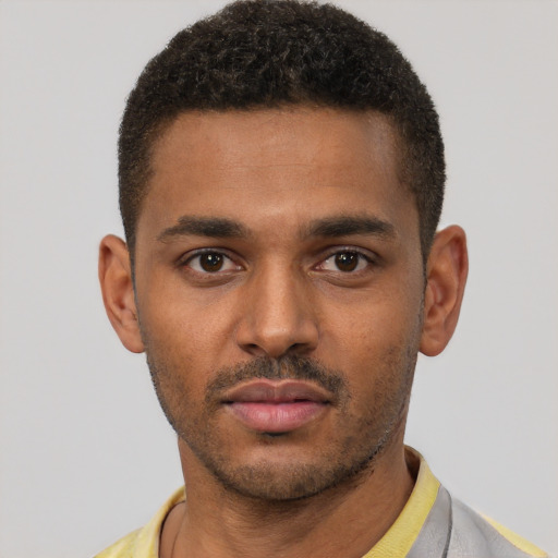 Neutral black young-adult male with short  black hair and brown eyes