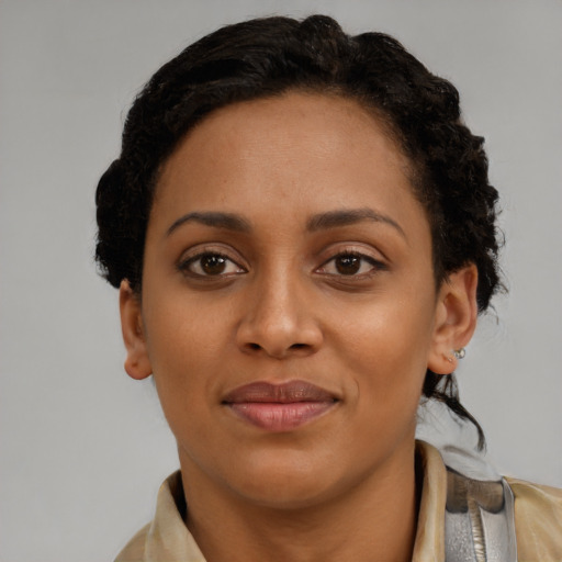 Joyful latino young-adult female with short  brown hair and brown eyes