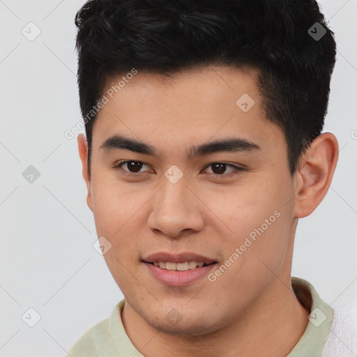 Joyful asian young-adult male with short  brown hair and brown eyes