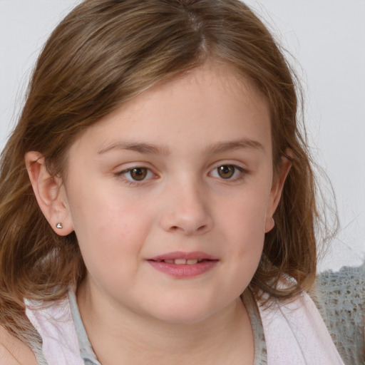 Joyful white child female with medium  brown hair and blue eyes