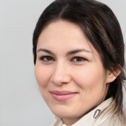 Joyful white young-adult female with medium  brown hair and brown eyes