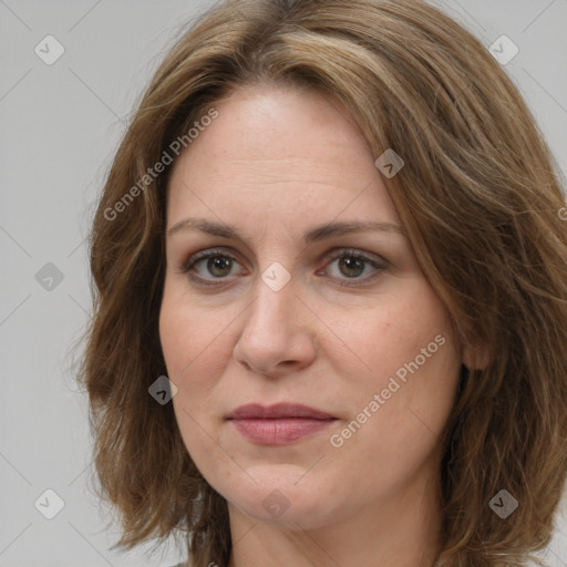 Joyful white adult female with long  brown hair and brown eyes