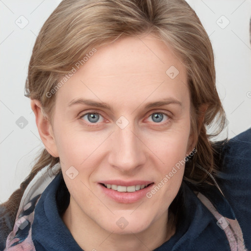 Joyful white young-adult female with medium  brown hair and blue eyes