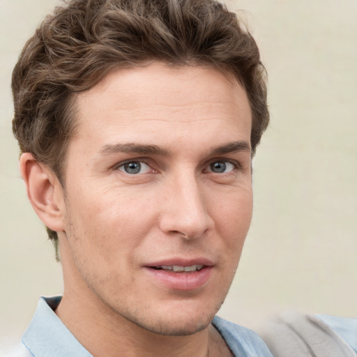 Joyful white adult male with short  brown hair and grey eyes