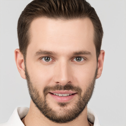 Joyful white young-adult male with short  brown hair and brown eyes