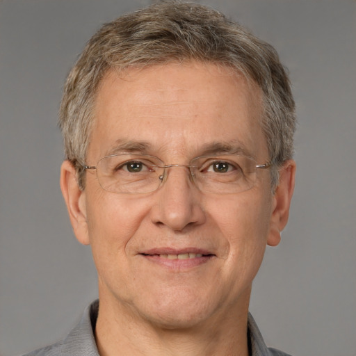 Joyful white middle-aged male with short  gray hair and brown eyes