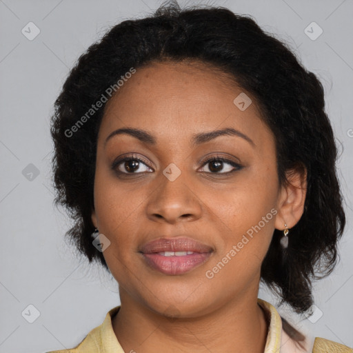 Joyful black adult female with medium  brown hair and brown eyes