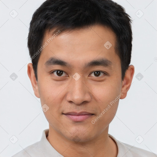 Joyful white young-adult male with short  black hair and brown eyes